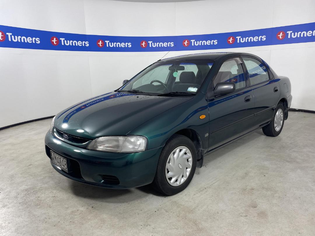 Damaged Ford Laser Glxi 1997 in North Shore at Turners Damaged and