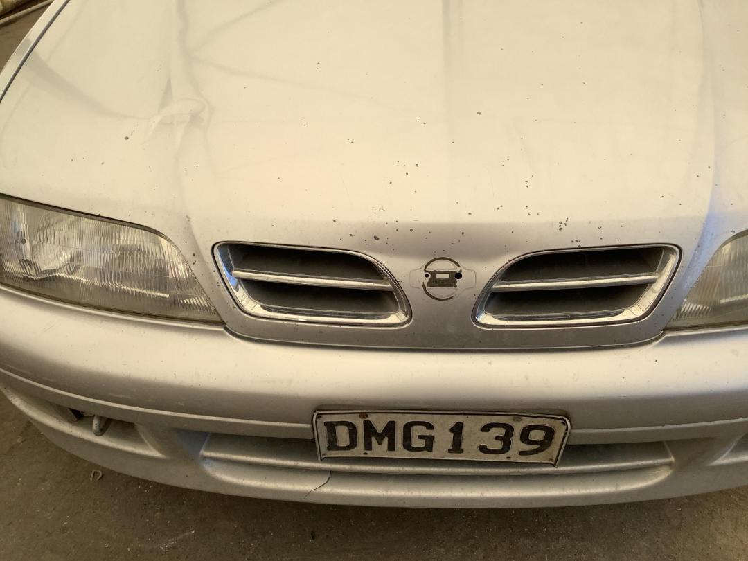 Damaged Nissan Primera 1997 in Christchurch Bromley at Turners