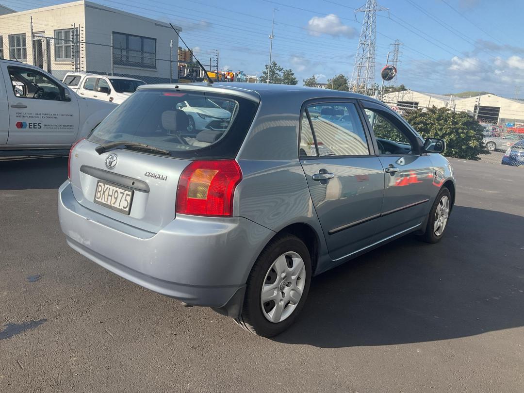 Damaged Toyota Corolla GL 2003 in Penrose Gavin Street at Turners