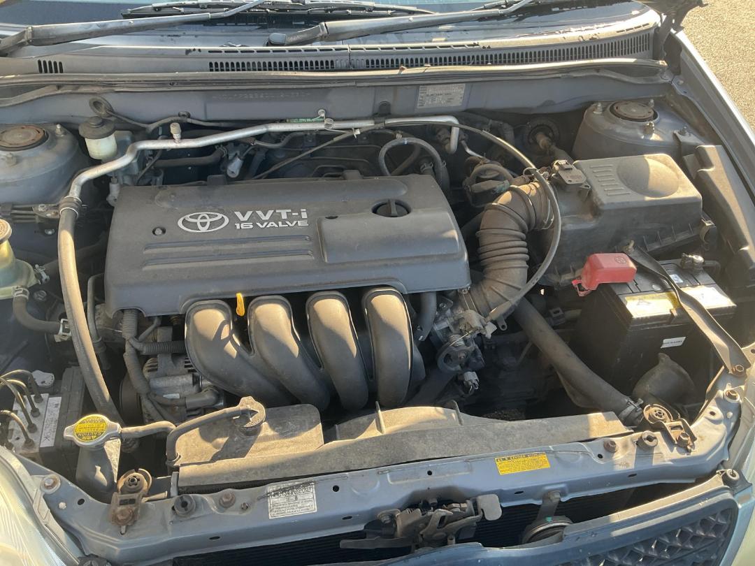 Damaged Toyota Corolla GL 2003 in Penrose Gavin Street at Turners