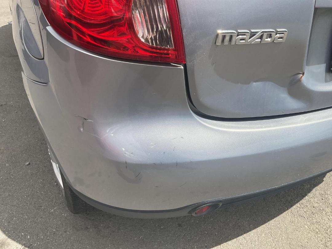Damaged Mazda Verisa 2007 in Wellington Seaview at Turners Damaged