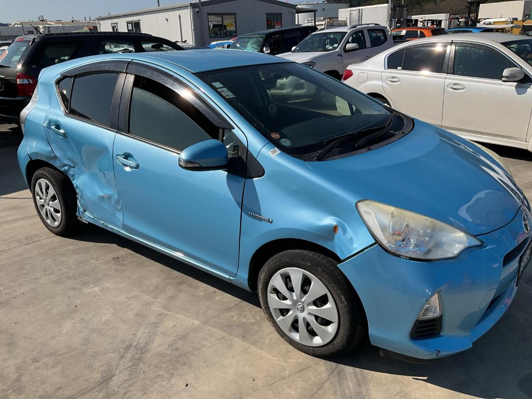 Damaged Toyota Aqua Hybrid 2013 in Wellington Seaview at Turners