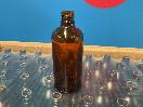 Thumbnail '2' of 140x Approx Amber Coloured Glass-Like 100mL Bottles