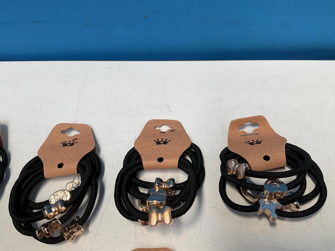 Photo '3' of 10x Packs of Black Coloured Hair Ties with Gold Coloured Designs *NEW*