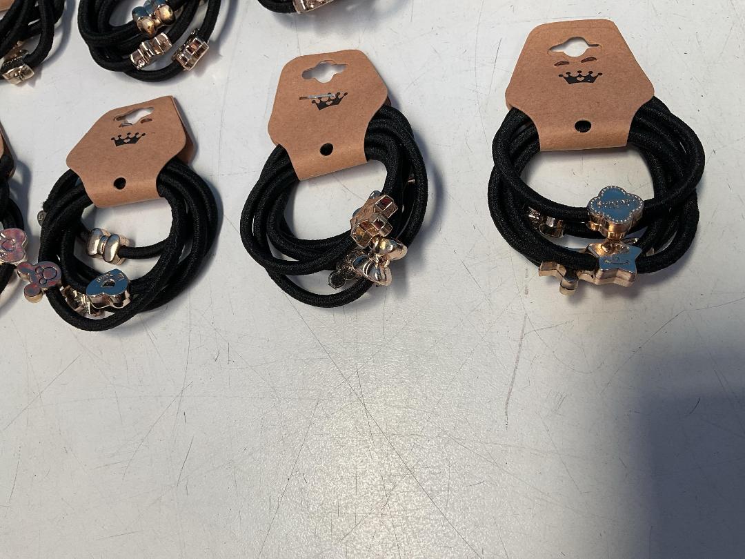 Photo '5' of 10x Packs of Black Coloured Hair Ties with Gold Coloured Designs *NEW*