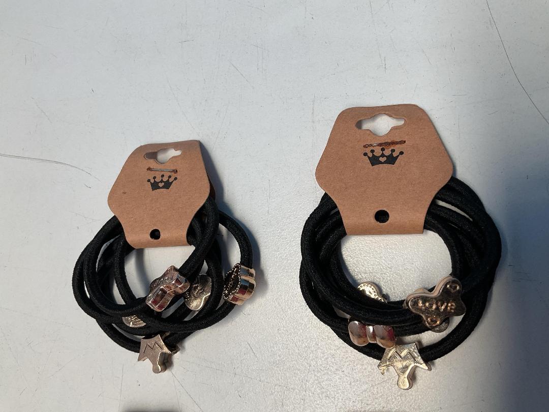 Photo '2' of 10x Packs of Black Coloured Hair Ties with Gold Coloured Designs *NEW*