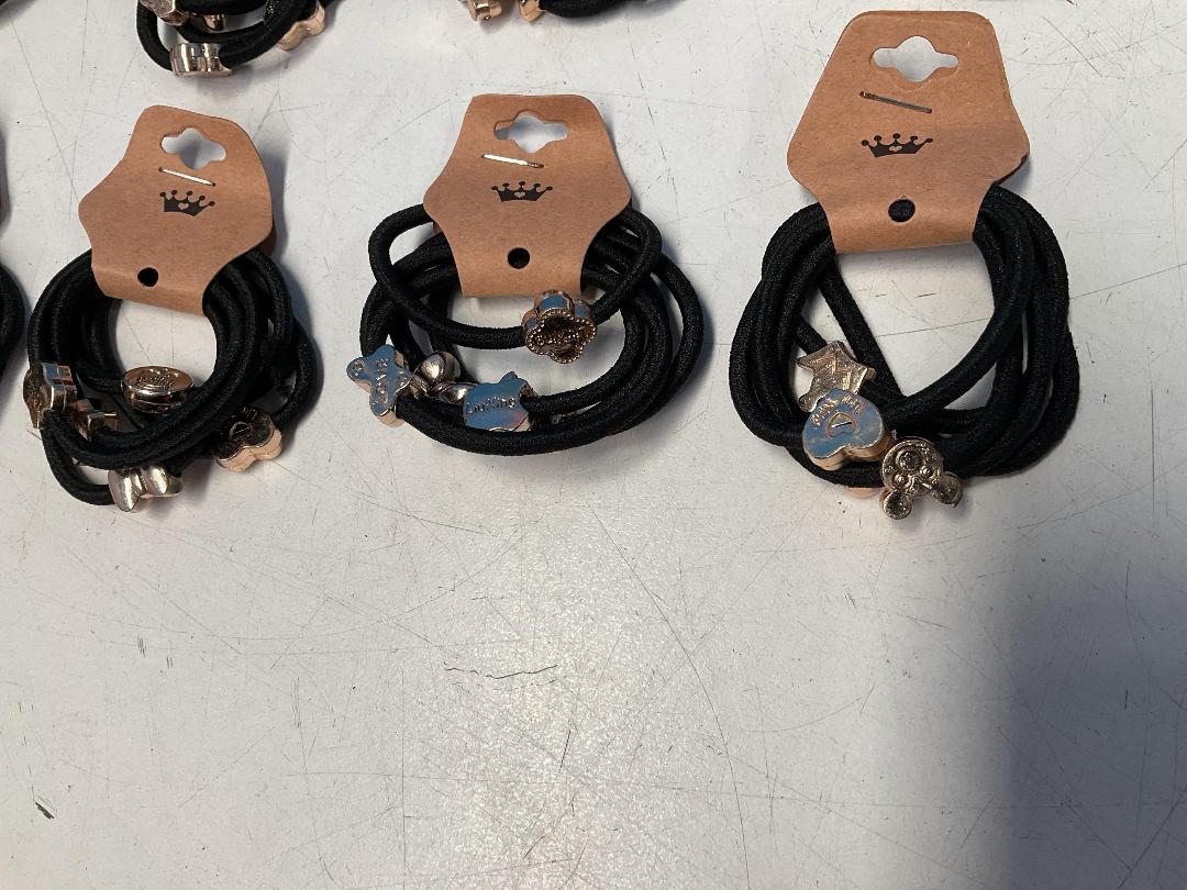 Photo '5' of 10x Packs of Black Coloured Hair Ties with Gold Coloured Designs *NEW*