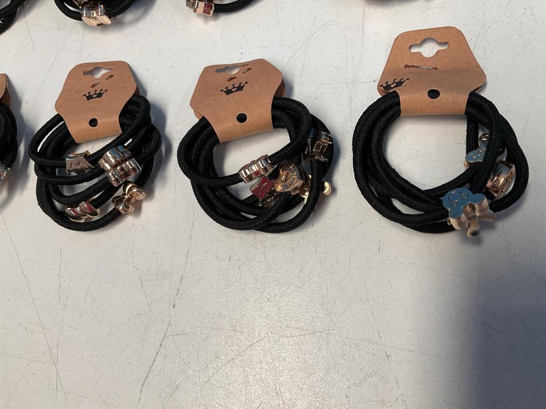 Photo '5' of 10x Packs of Black Coloured Hair Ties with Gold Coloured Designs *NEW*