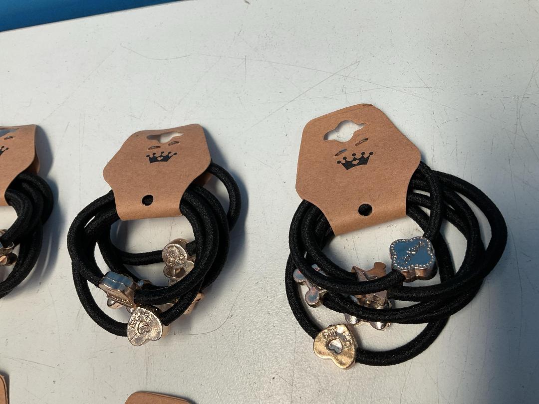 Photo '3' of 10x Packs of Black Coloured Hair Ties with Gold Coloured Designs *NEW*