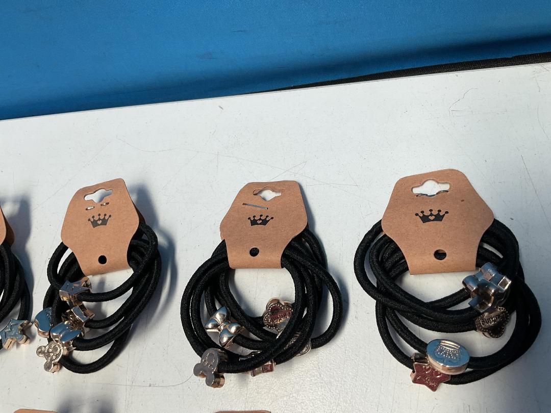 Photo '3' of 10x Packs of Black Coloured Hair Ties with Gold Coloured Designs *NEW*