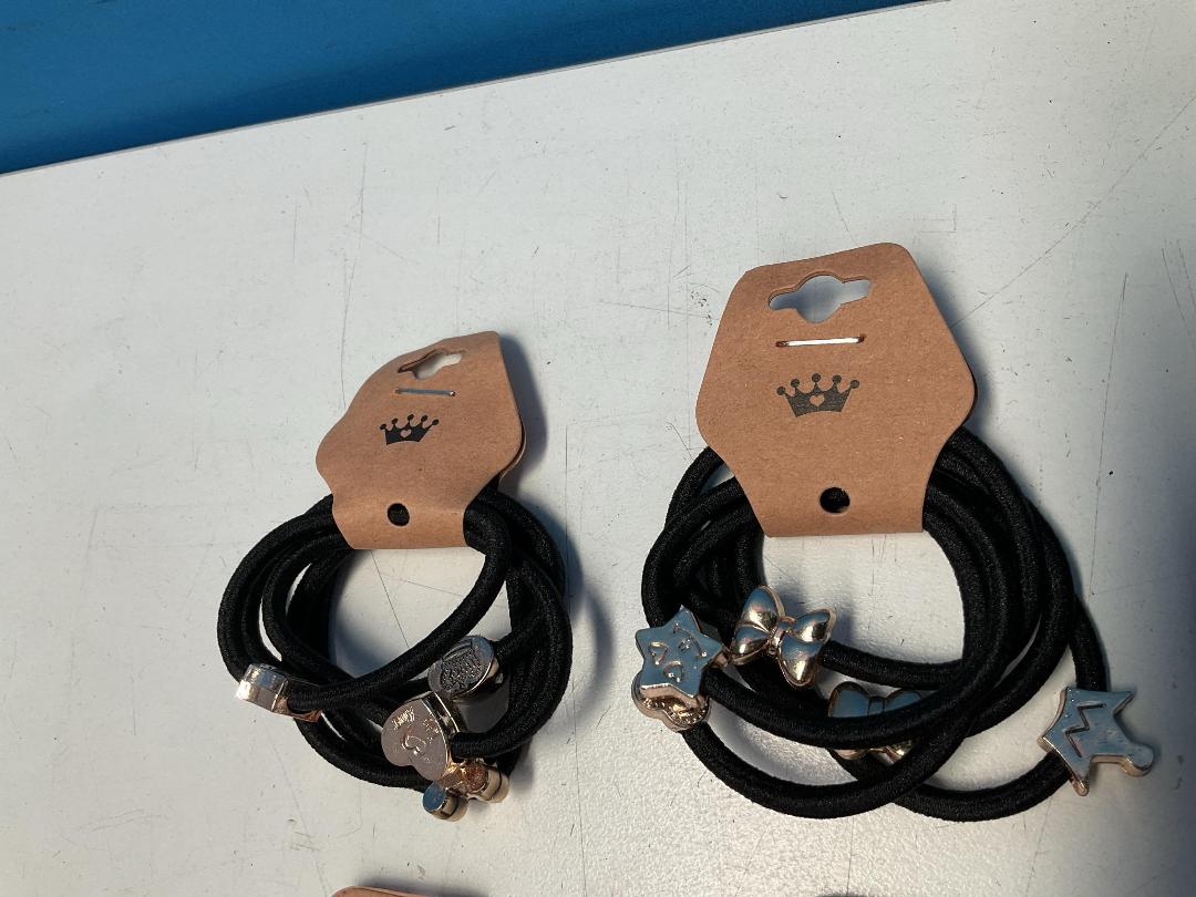 Photo '2' of 10x Packs of Black Coloured Hair Ties with Gold Coloured Designs *NEW*