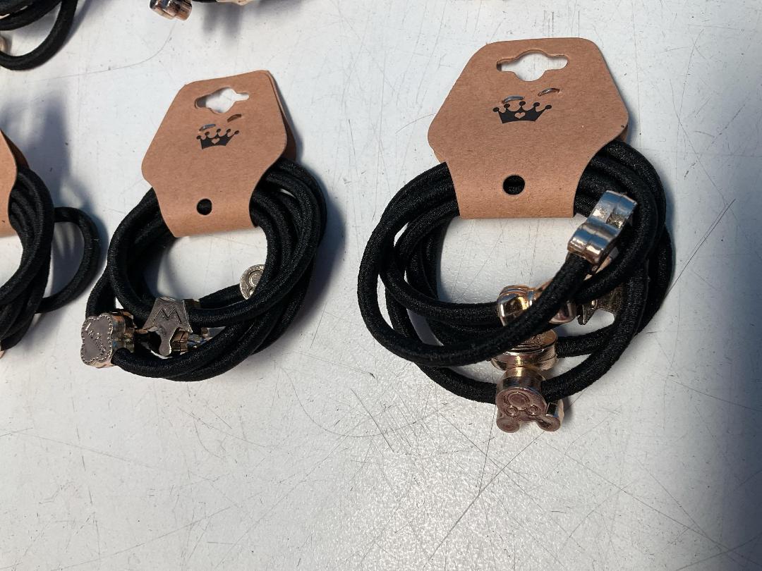 Photo '5' of 10x Packs of Black Coloured Hair Ties with Gold Coloured Designs *NEW*