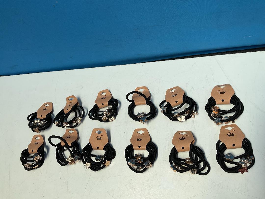 Photo '6' of 12x Packs of Black Coloured Hair Ties with Gold Coloured Designs *NEW*