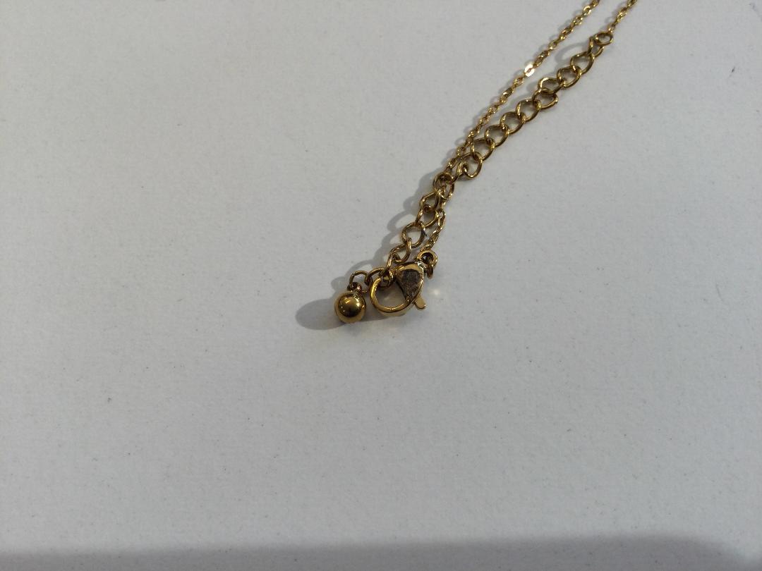Photo '5' of Gold coloured necklace with clear stone pendant