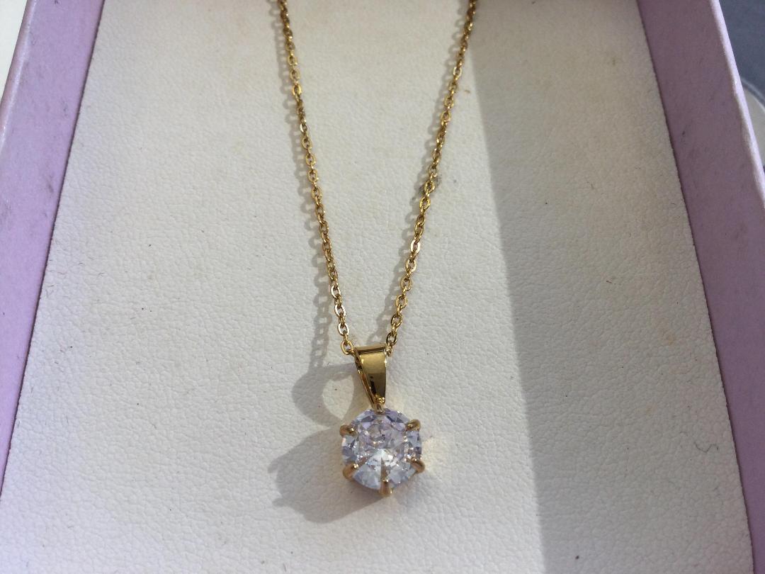 Photo '2' of Gold coloured necklace with clear stone pendant