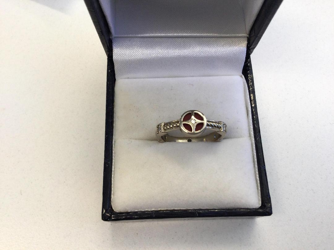 Photo '2' of Silver Coloured Ring with red and clear stones