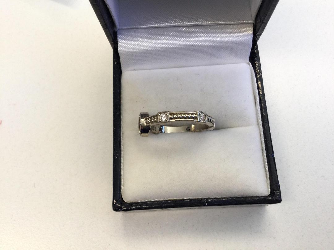 Photo '3' of Silver Coloured Ring with red and clear stones