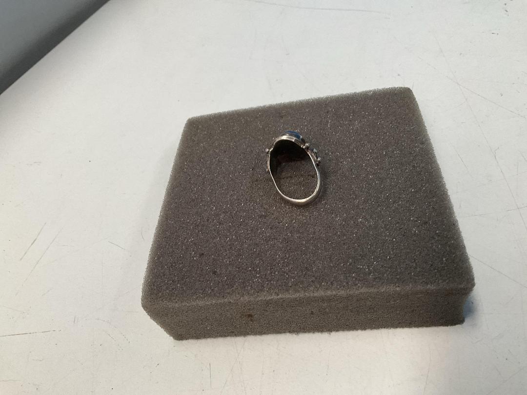 Photo '4' of Silver Coloured Ring with Blue Coloured Stone - Ring Bent Out of Shape